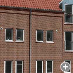фото дома с фасадом из облицовочного кирпича randers tegl в цвете RT 444 rotbunt фасад из кирпича ручной формовки